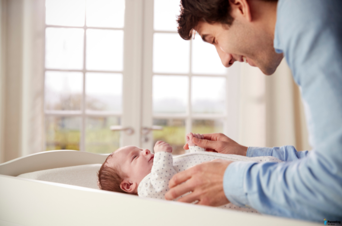 How dads can bond with newborns through gentle playtime, touch, and interaction during early infancy.