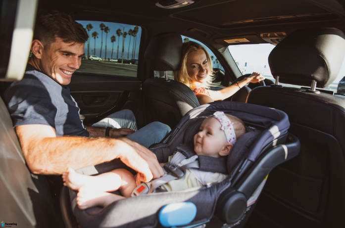 Baby travel tips showing safe infant car seat use during a road trip.