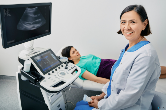 Ultrasound in pregnancy showing baby heartbeat on screen