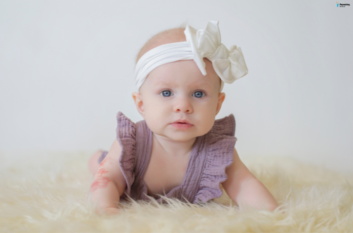 Baby enjoying cool comfort with light summer clothing, part of a baby skin care for summers plan.
